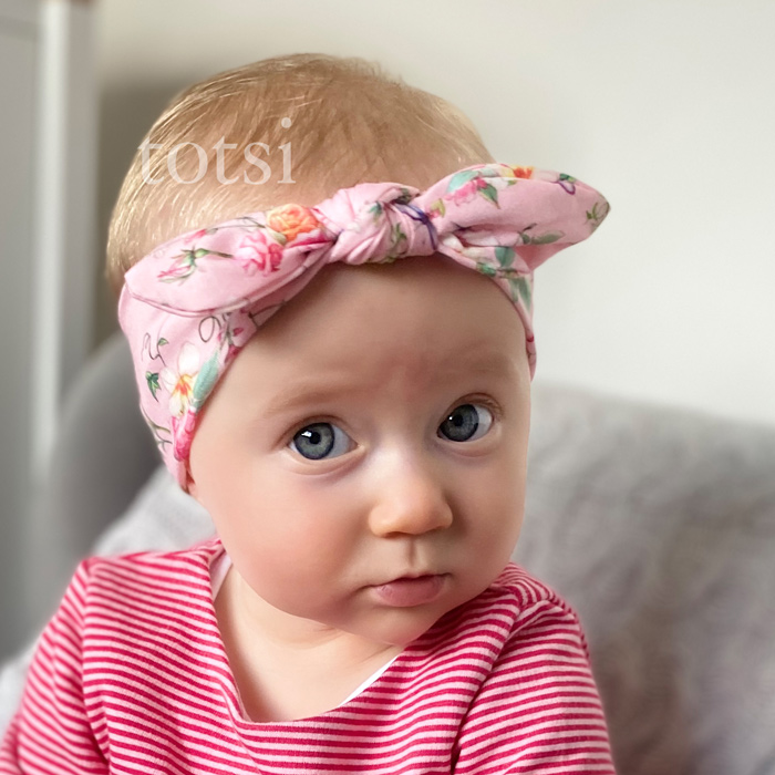 Girl wearing a totsi baby headband
